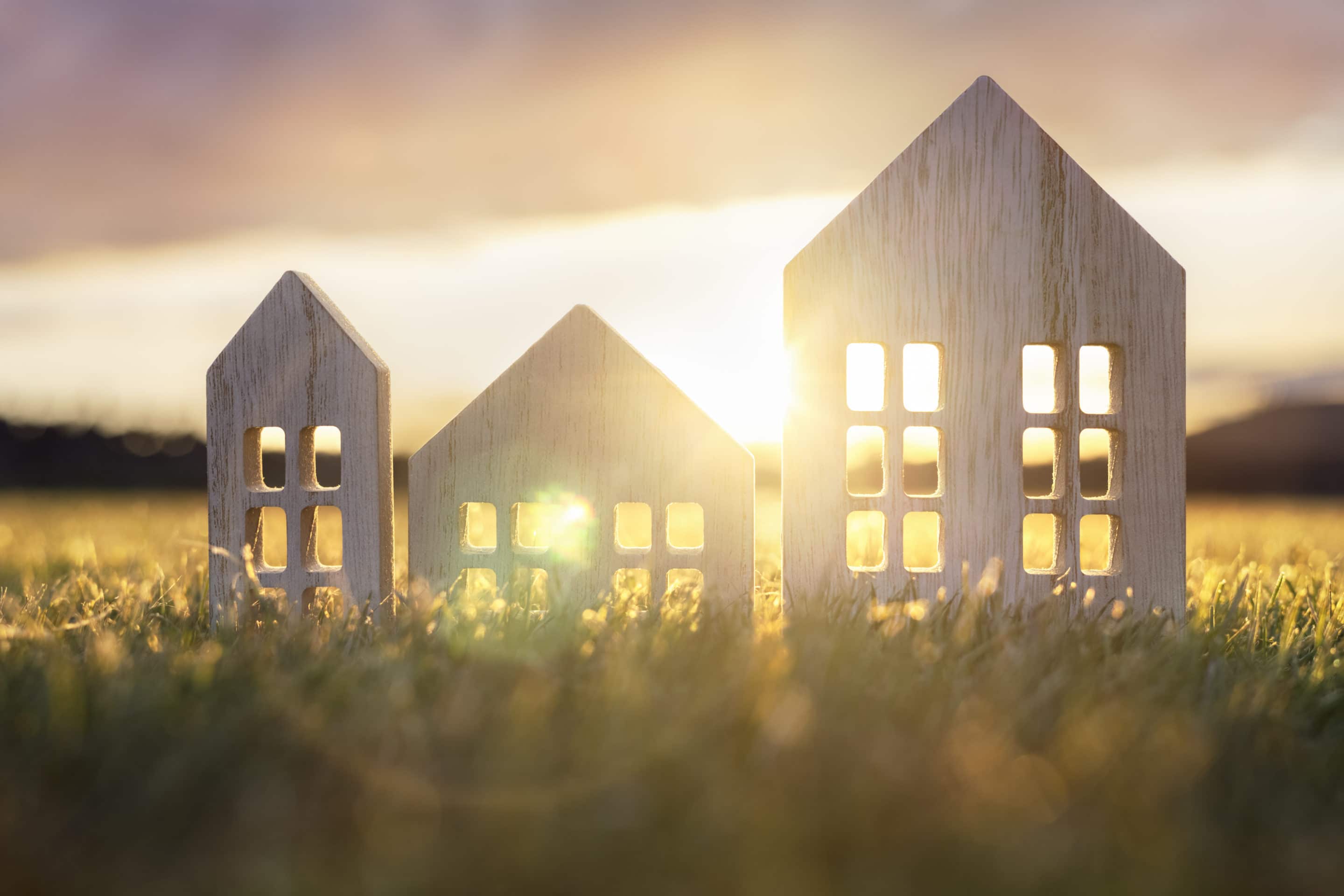 Ecological wood model house in empty field at sunset collage of images